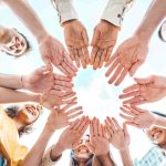 group-of-young-people-stacking-hands-outdoors-2023-11-27-05-23-54-utc Rewarding performance with bonus