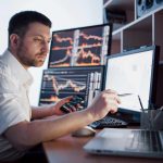 stockbroker-in-shirt-is-working-in-a-monitoring-ro-2023-11-27-05-08-36-utc Bonus offer for performance achievements